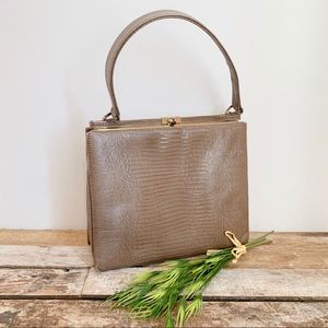 Mam’Selle vintage tan lock purse.